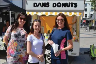  ?? ABOVE: LEFT: ?? Helena Coffey, Kim O’Connell and Bridget Coffey pictured enjoying some of Dan’s Donuts at the inaugural Tralee Square Market on Thursday.