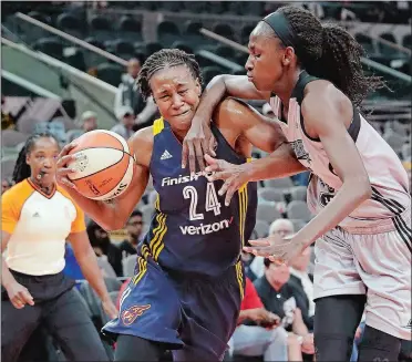  ?? ERIC GAY/AP PHOTO ?? Indiana Fever forward Tamika Catchings (24) is fouled as she drives around San Antonio’s Astou Ndour during a Sept. 6 game in Texas. Catchings, who is retiring after the 2016 WNBA season, will play her final game at Mohegan Sun Arena on Tuesday night...