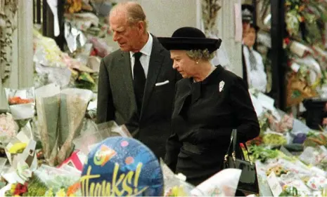  ?? PHOTO: AP ?? Queen Elizabeth II and her husband the Duke of Edinburgh view the floral tributes to Diana, after a public outcry for the Queen to react to the People’s Princess’s death.