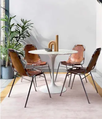  ?? ?? The golden rule for the dining room is to opt for a rug that is approx 100cm to 120cm larger than the table, so that chairs don’t get caught on the edges. It will also frame the table nicely. Mohair Border Rose Quartz rug, €3,330, therugcomp­any.com
Rugs are a great way to add a soft touch to cold bathroom floors. Designs made from synthetic materials are best for such high-humidity areas as they are more water-resistant and easy to clean. When laying a rug in the bathroom it is also important to fit an underlay to prevent it slipping on hard floors. For a similar rug try ruggable.eu.