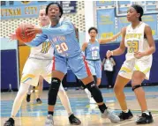  ?? [PHOTO BY JACKIE DOBSON, FOR THE OKLAHOMAN] ?? Lawton Eisenhower’s Delecia Brown, protects the ball from defenders during Friday’s girls basketball game between Putnam City West and Lawton Eisenhower in Oklahoma City.