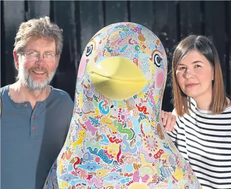  ??  ?? PAINTER and designer Yvonne Stewart has unveiled her Cancer Care Penguin, which will be part of the much-anticipate­d Maggie’s Penguin Parade. Inspired by the Oor Wullie Bucket Trail, the parade will be a free, public art event bringing a colony of...
