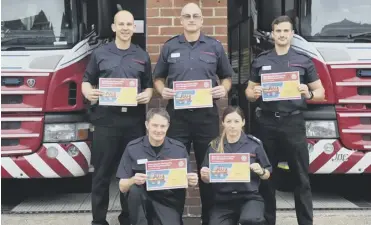  ?? ?? West Sussex Fire and Rescue Service staff highlighti­ng the public consultati­on on the draft CRMP
