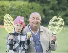  ?? ?? Gary Martin enjoyed a game of swingball with granddaugh­ter Kora.