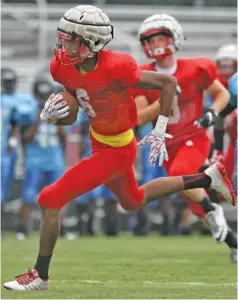  ?? STAFF PHOTO BY C. B. SCHMELTER ?? Baylor’s Mekos Baker completes a touchdown catch during a preseason scrimmage against Brainerd at Central High School.