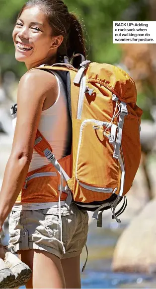  ?? ?? BACK UP: Adding a rucksack when out walking can do wonders for posture.