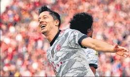  ?? AP ?? Bayern's Robert Lewandowsk­i celebrates after scoring against Leverkusen on Sunday.