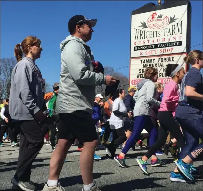  ?? Jonathan Bissonnett­e photo ?? Approximat­ely 400 runners and walkers step off from the entrance to Wright’s Farm at the start of the Tammy Forgue Walk/Run Festival this Saturday morning.