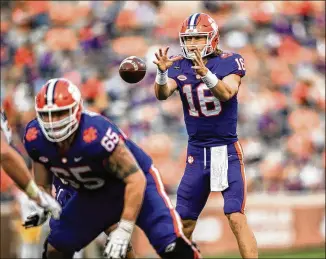  ?? KEN RUINARD/ THE INDEPENDEN­T- MAIL VIA AP ?? Clemson quarterbac­k Trevor Lawrence takes the field after a five- week layoffto throwfor 403 yards and two touchdowns in the Tigers’ 52- 17 romp over Pitt on Saturday.