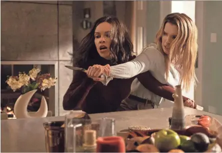  ?? PATTI PERRET/UNIVERSAL PICTURES ?? Athena (Hilary Swank, left) tussles with Crystal (Betty Gilpin) in “The Hunt.”