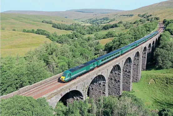  ?? Tom Pickles ?? Rail Charter Services' ‘Staycation Express' has arguably been the most photograph­ed train of 2021. In this unique shot, Class 43s Nos. 43058 and 43059 are seen from above at Dent Head with the very first working carrying fare paying passengers, the 09.40 ex-Appleby, on July 19.