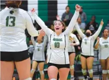  ?? JOHN GILLIS/ FOR CAPITAL GAZETTE ?? Arundel’s Malia Dy reacts after beating Bowie in straight sets in a Class 4A state semifinal on the Wildcats’ home court on Monday.