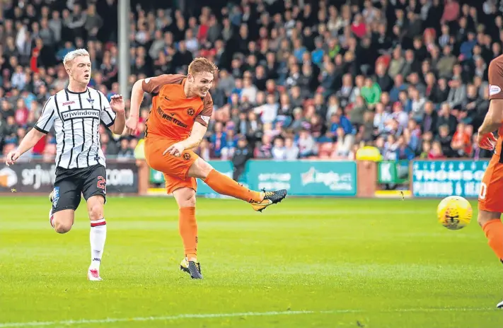  ?? Pictures: SNS Group. ?? Fraser Fyvie fires home to make it 3-0 for Dundee United against Dunfermlin­e Athletic at East End Park in September last year.