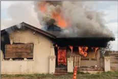  ?? COURTESY OF LODI FIRE BATTALION CHIEF TIM ORTEGEL ?? A vacant house on South Stockton Street near Harney Lane in Lodi is used for a controlled burn exercise by the Lodi Fire Department and several neighborin­g fire districts on Monday.