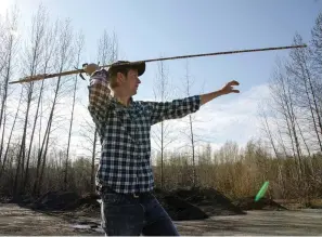  ?? Submitted photo ?? ■ Joshua Lynch of Arkansas Tech University demonstrat­es the use of an atlatl, or spearthrow­er.