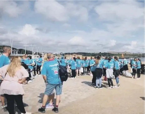  ??  ?? More than 100 people turned out for the walk wearing t-shirts in memory of Trisha Dalton Atkinson.