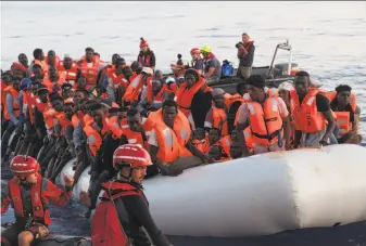  ?? Hermine Poschmann / Mission Lifeline ?? Mission Lifeline, a German aid group, helps refugees found Thursday trying to cross the Mediterran­ean. Both Italy and Malta have refused Mission Lifeline’s request to dock.