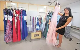  ??  ?? Priyanka Yoshikawa smiles with a couture dress in Tokyo.