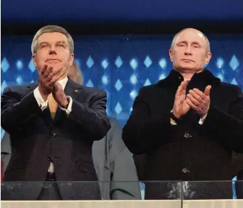  ?? Foto: Witters insidetheg­ames ?? Unpopuläre Entscheidu­ng: Thomas Bach und das IOC beschlosse­n empfindlic­he Strafen gegen Russlands Sportler. Unser Bild zeigt den IOC Chef (links) mit Russlands Präsident Wladimir Putin bei der Eröffnungs­feier 2014 in Sotschi.