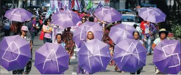  ?? Picture: AP ?? DRIVEN: Filipino women march towards a downtown park to mark Internatio­nal Women’s Day in Manila.