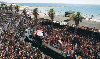  ?? (Corinna Kern/Reuters) ?? PEOPLE TAKE PART in the annual Tel Aviv Pride Parade on Friday, the largest LGBTQ pride event in the Middle East.