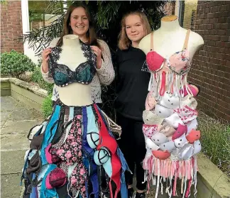  ?? PHOTO: VIRGINIA FALLON/FAIRFAX NZ ?? Crystal Goodwin-Ford, left, and Hannah Sherring with the dresses they made out of donated bras for their school’s wearable arts competitio­n.