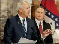  ?? Arkansas Democrat-Gazette/JEFF GAMMONS ?? Gov. Asa Hutchinson (left) speaks during a news conference Wednesday at the state Capitol to announce a new resource for Arkansans suffering with mental-health and substance-abuse issues. Listening is Jay Hill, director of the state Department of Human Services’ division of Aging, Adult, & Behavioral Health Services.