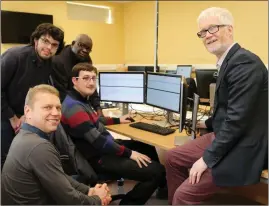  ??  ?? Students Kevin, Tom, Javed and Oli pictured with their Teacher John Petty in the Computer Systems & Networks Department during Open Day at Mallow College.