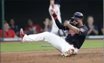  ?? Tony Dejak ?? Cleveland Indians first baseman Yonder Alonso celebrates after scoring in the third inning against the Cincinnati Reds on Wednesday in Cleveland.
The Associated Press