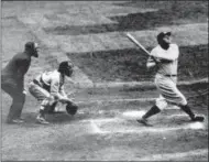  ?? THE ASSOCIATED PRESS ?? In this undated file photo, New York Yankees’ Babe Ruth hits a home-run. As part of its collection of Babe Ruth items, the Baseball Hall of Fame says it has the bat the slugger used to hit his then-record 60th home run in 1927.