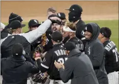  ?? AP photo ?? White Sox pitcher Carlos Rodon celebrates his no-hitter with teammates Wednesday.