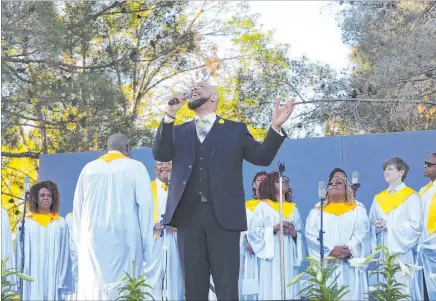  ?? Rachel Aston Las Vegas Review-journal @rookie__rae ?? Top, Genevieve Dew sings at the 36th annual Easter sunrise service at Palm Eastern Mortuary in Las Vegas. Above, James Smith sings alongside the Las Vegas Mass Choir at the event, which also was set to feature performanc­es by Lily Arce and the Rev. Bill Walker.