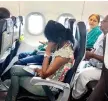  ??  ?? Passengers waiting inside the GoAir aircraft on Monday