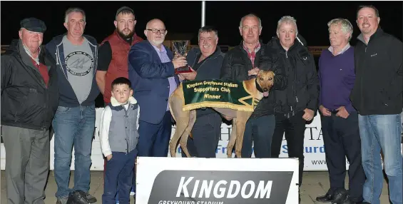  ?? Photo by www.deniswalsh­photograph­y.com ?? Chairman of the K.G.S.S.C. Murt Murphy presents the winner’s trophy to winning owner Noel Power (Ballyduff) after Jasons Fifi won the K.G.S.S.C. Stakes final at the Kingdom Greyhound Stadium on Friday night. Included, from left, Andrew Sheehy, Denis...