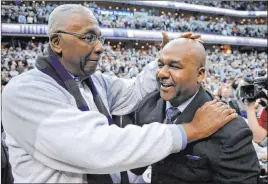  ?? Nick Wass The Associated Press ?? John Thompson, left, congratula­tes his son, Georgetown coach John Thompson III, after the Hoyas’ 61-39 win over Syracuse in the 2013 NCAA Tournament.