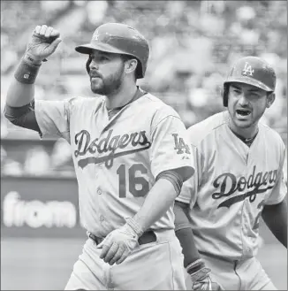  ?? Lenny Ignelzi
Associated Press ?? THE DODGERS’ Adrian Gonzalez shouts to teammate Andre Ethier after Ethier’s two-run home run in the first inning against San Diego. Ethier started in place of the sidelined Yasiel Puig.