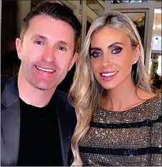  ??  ?? LOSS: Robbie Keane is being comforted by wife Claudine