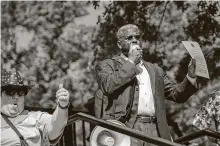  ??  ?? AllenWest, Texas Republican Party chairman, speaks at the protest. Attendees demanded Abbott end his mask mandate.