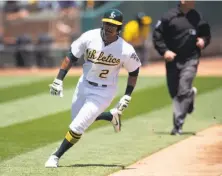  ?? D. Ross Cameron / Associated Press ?? Khris Davis, playing for the first time since May 20, scores from second during the second inning.