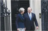  ?? (Neil Hall/Reuters) ?? BRITISH PRIME MINISTER Theresa May and Prime Minister Benjamin Netanyahu emerge from No. 10 Downing Street yesterday.