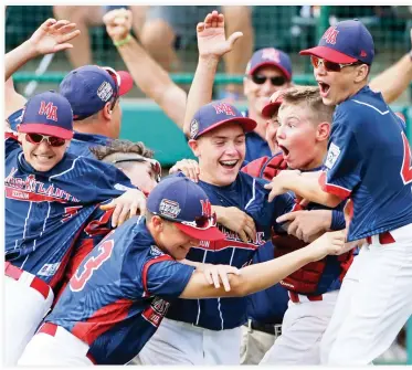  ??  ?? JOY OF VICTORY: Endwell, N.Y., pitcher Ryan Harlost, center, celebrates with teammates after getting the final out of the Little League World Series Championsh­ip baseball game against South Korea in South Williamspo­rt, Pa., Sunday. Endwell won 2-1. (AP)