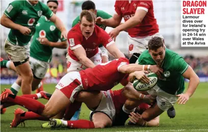  ??  ?? DRAGON SLAYER Larmour dives over for Ireland’s opening try in 24-14 win over Wales at the Aviva