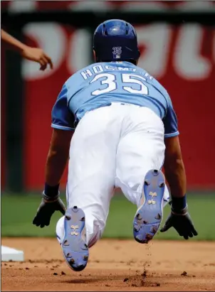  ?? The Associated Press ?? HEAD-FIRST SLIDE: Kansas City’s Eric Hosmer dives to second after hitting a double during the second inning of the Royals’ home game against the Boston Red Sox Wednesday. The streaking Royals scored four runs in the eighth inning for a 6-4 victory.