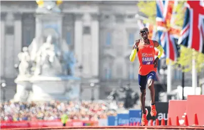  ??  ?? Sir Mo Farah crosses the line to set a new British record for the marathon of 2:06:21