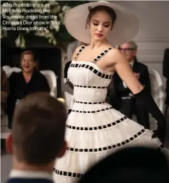  ?? ?? Alba Baptista stars as Natasha modeling the Vaudeville dress from the Christian Dior show in “Mrs. Harris Goes to Paris.”