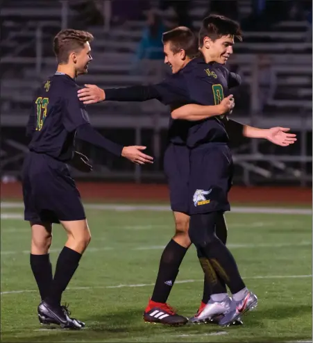  ?? Photo by Michelle Menard ?? North Smithfield senior Bryan Decelles, right, scored goals in both halves to lead the first-place Northmen to a 2-1 Division II victory over visiting Burrillvil­le Tuesday night. The Broncos received a second-half goal from Nick Hammond.