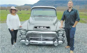  ??  ?? Desiree and Nate Bestward display their 1957 GMC pickup that was rebuilt by the reality TV show Carspottin­g.