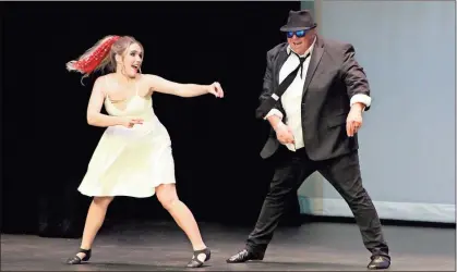  ?? / Spencer Lahr ?? Floyd County police Sgt. Rusty Williams performs with Hannah Camacho during the Rome Celebrity Dance Challenge on Saturday night.