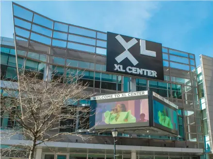  ?? AARON FLAUM/HARTFORD COURANT ?? A video of Lizzo on the marquee Thursday advertises her upcoming concert at Hartford’s XL Center. The arena has been in need of upgrades for years, Hartford Mayor Luke Bronin says.