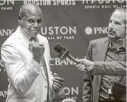  ?? Photos by Steve Gonzales / Staff photograph­er ?? Last year’s Houston Sports Hall of Fame inductees, from left, Rudy Tomjanovic­h, Mary Lou Retton and Carl Lewis, were honored Thursday during a ring ceremony.